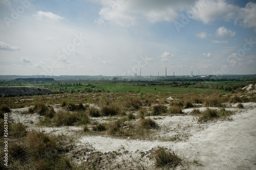 Mountains of phosphoric acid production waste from chemical plant. Futuristic landscape photo