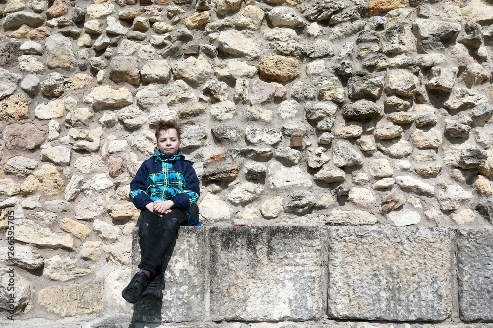 Child on background of fortress wall Child on background of fortress wall