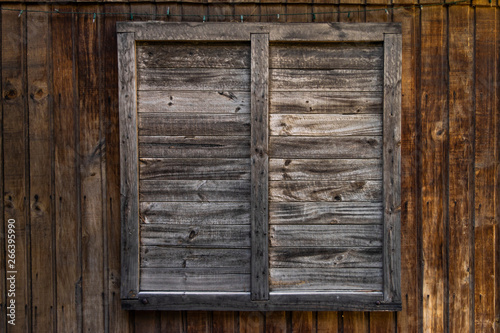 window on old wooden wall