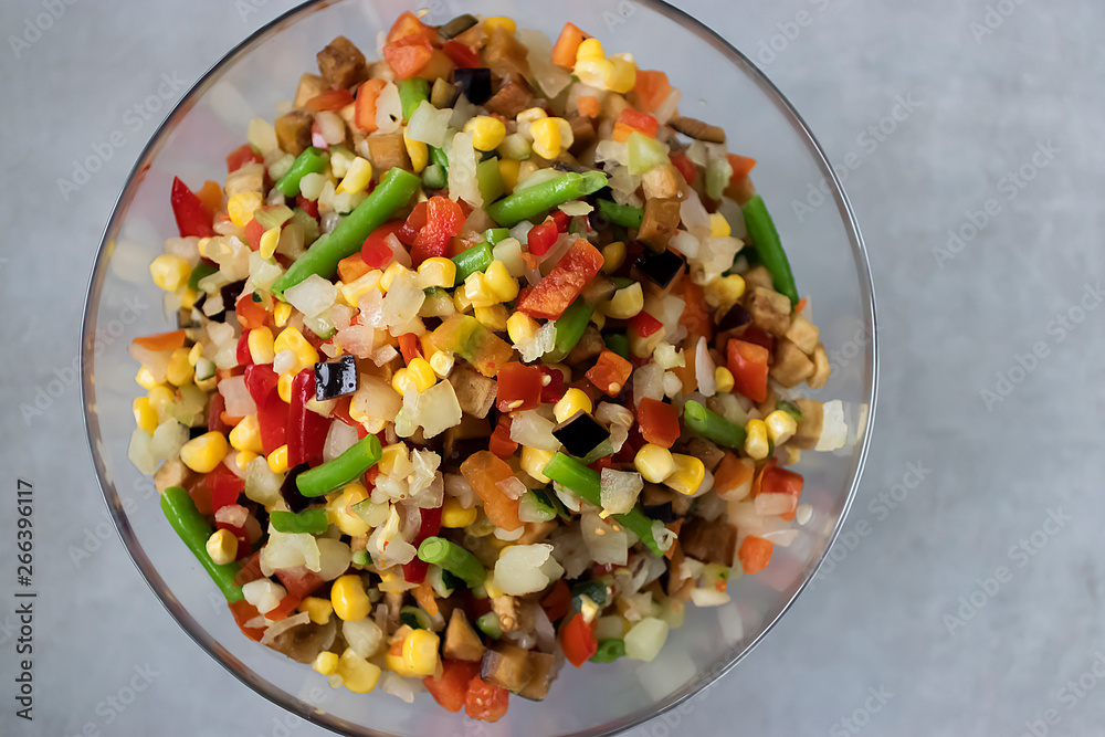 Mix frozen vegetables in a glass bowl. Concept of vegetarianism and healthy eating. Mix frozen vegetables in a glass bowl. Concept of vegetarianism and healthy eating.