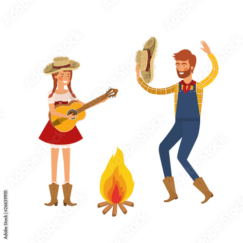 farmers couple dancing with straw hat and bonfire