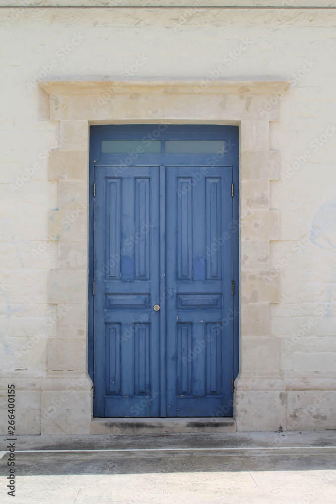  blue wooden front door without a door knob