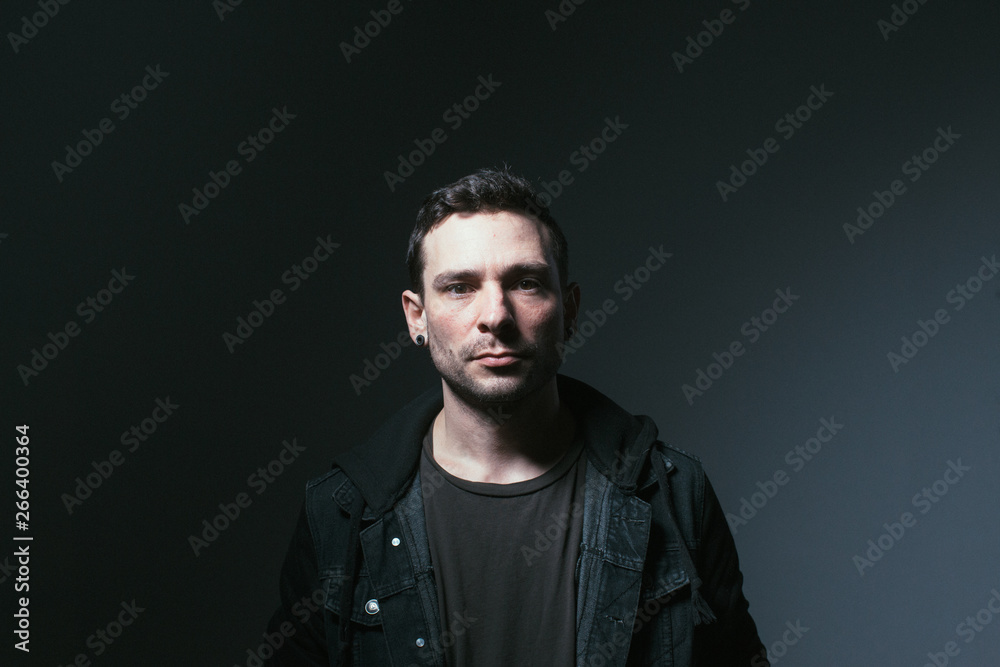 Serious man in dark room Serious man in dark room