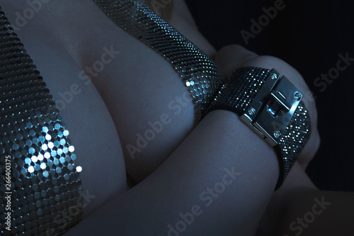 dark shiny silver bra and bracelet closeup
