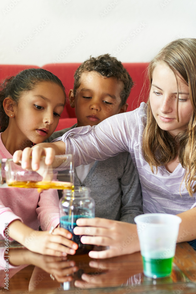Kid's science: Mixing of colorful liquids Kid's science: Mixing of colorful liquids