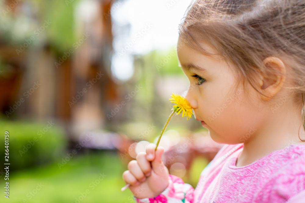 Little child girl playing outdoor on a warm spring day. - Image . Little child girl playing outdoor on a warm spring day. - Image .