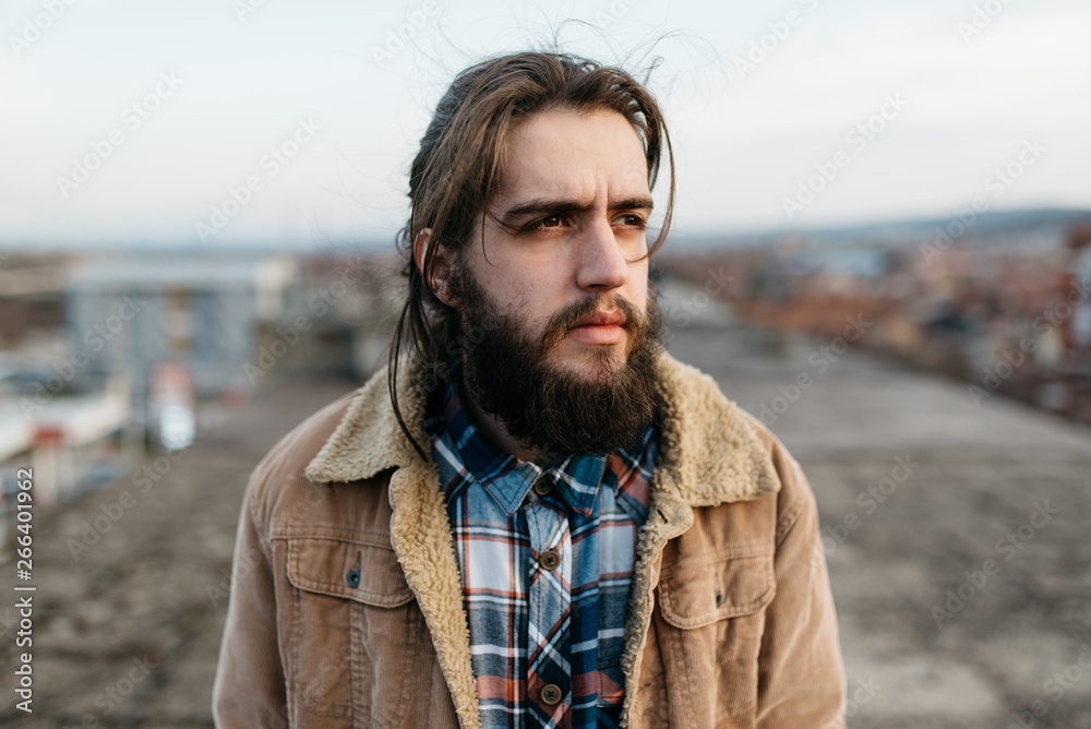 Beard Man with a Long Hair on the Rooftop Beard Man with a Long Hair on the Rooftop