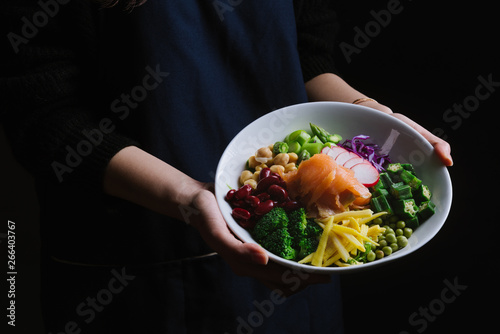 Woman holding salad bowl