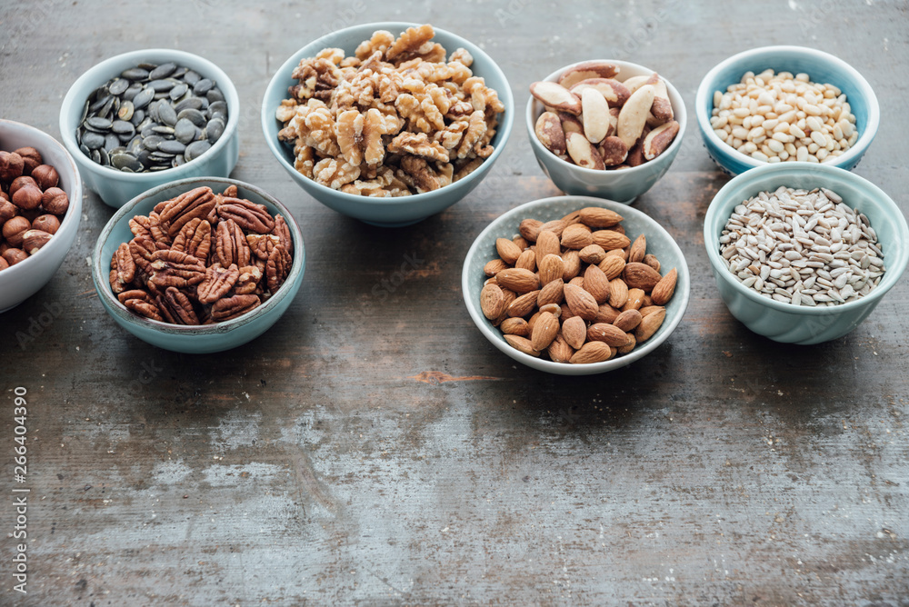 Food: Variation of nuts in bowls Food: Variation of nuts in bowls