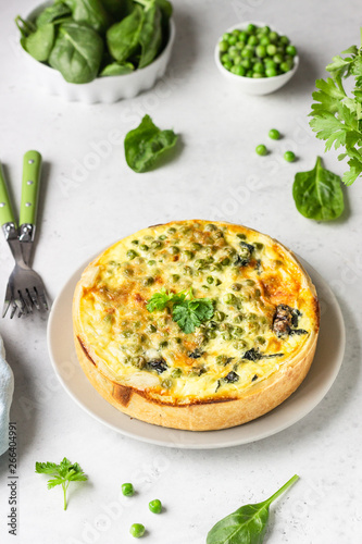 Wallpaper Mural Spinach and green pea quiche, tart or pie with fresh ingredients for baking. Light grey background, copy space.  Torontodigital.ca