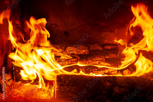 Burning billets in fireplace