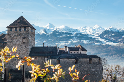 Vaduz castle on snow mountains background photo