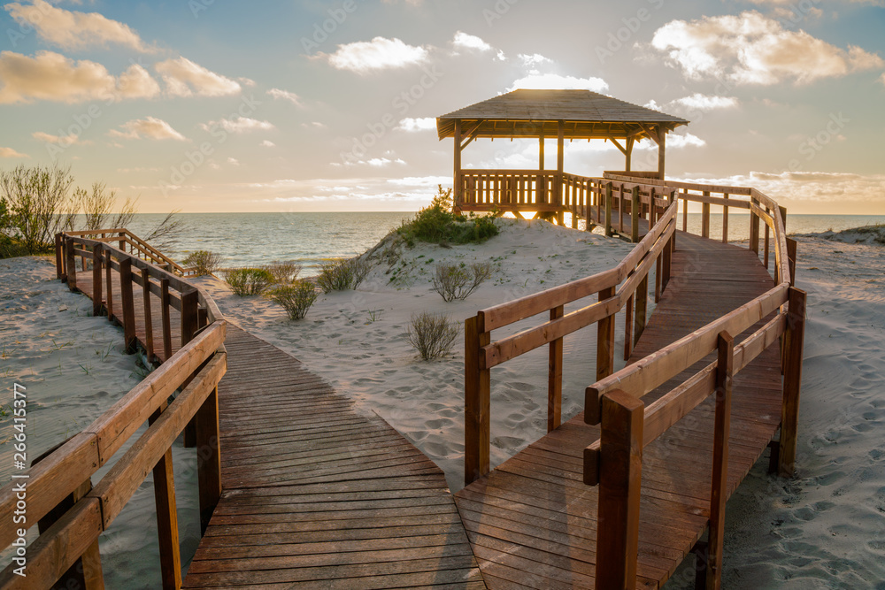 Very nice view of the access to the sea. Wooden sidewalk to the beach. Observation deck on the shores of the Baltic Sea. Very nice view of the access to the sea. Wooden sidewalk to the beach. Observation deck on the shores of the Baltic Sea.