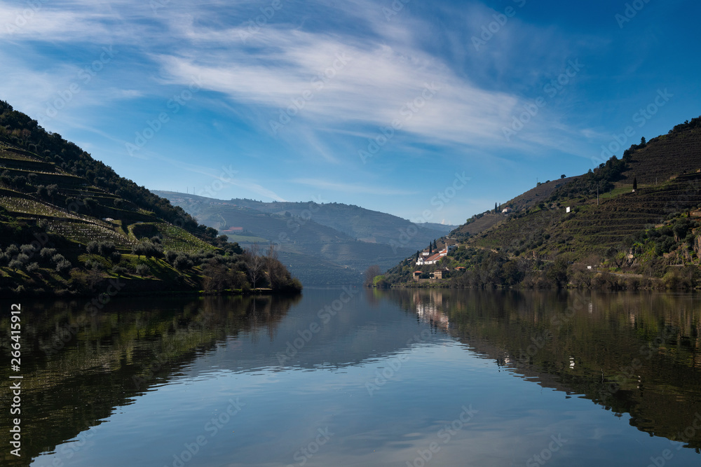 View of Douro River with terraced vineyards near the village of Pinhao, in Portugal; Concept for travel in Portugal and most beautiful places in Portugal View of Douro River with terraced vineyards near the village of Pinhao, in Portugal; Concept for travel in Portugal and most beautiful places in Portugal