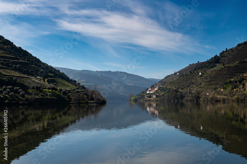 View of Douro River with terraced vineyards near the village of Pinhao, in Portugal  Concept for travel in Portugal and most beautiful places in Portugal © Tiago Fernandez