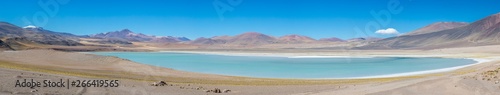 Tuyajto Lagoon, amazing turquoise colors at Atacama Desert. An awe arid landscape full of salt flats and lakes on a high altitude environment with a beautiful volcanic scenery. Available at higher res