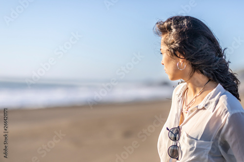 Canvas Print A beautiful young latin girl portrait with straight hair looking at the view