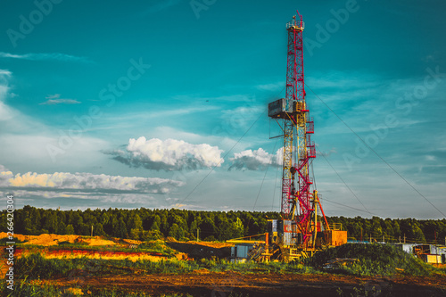 Foto Land oil drilling rig blue sky