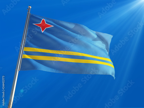 Aruba National Flag Waving on pole against deep blue sky background. High Definition