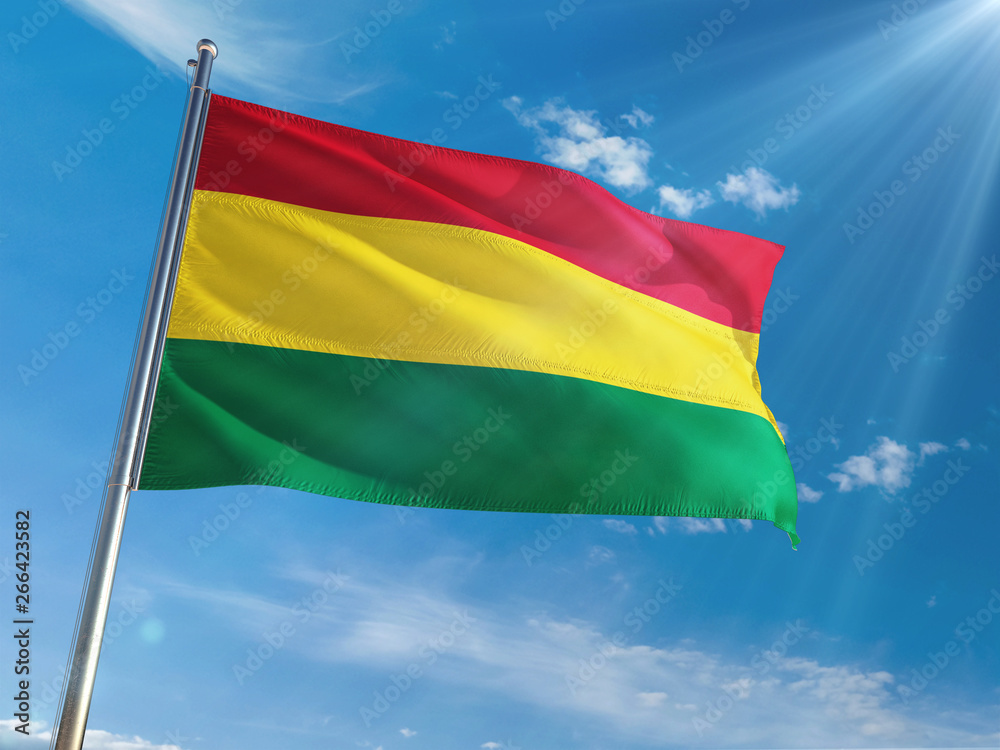 Bolivia National Flag Waving on pole against sunny blue sky background. High Definition Bolivia National Flag Waving on pole against sunny blue sky background. High Definition