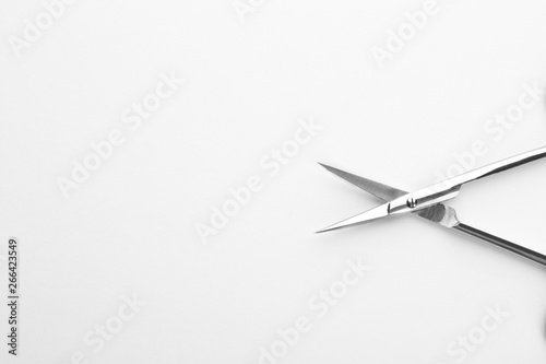 Pair of nail scissors on white background