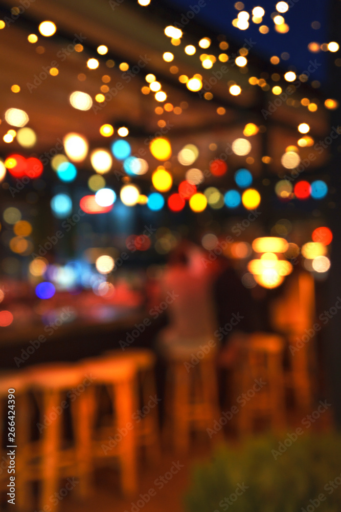 Blurred background of people sitting at restaurant, bar or night club
