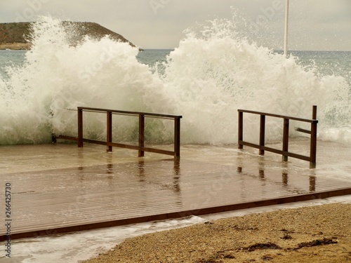 Wave crashing against the pier