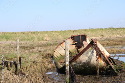 Old abandoned rowing boat. rusted and rotting rowing boat