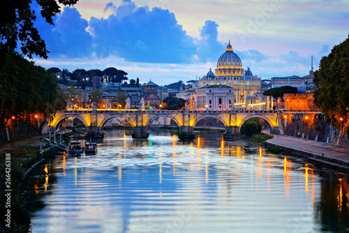 View of Vatican City and St Peters Basilica across the River Tiber at dusk, Rome, Italy