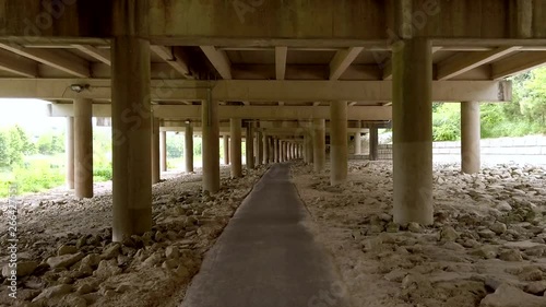 walking under a bridge