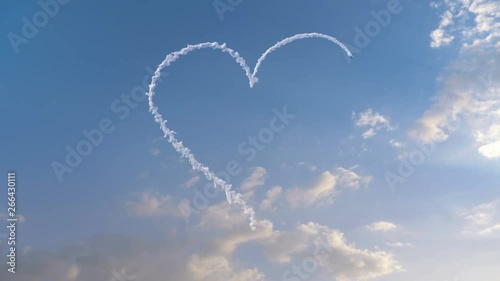 Airplane draws Heart shape on the sky