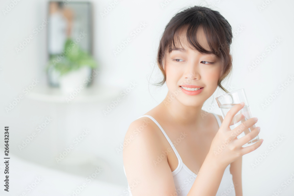Beautiful portrait young asian woman caucasian smiling with nutrition thirsty and drinking glass of water mineral with fresh and happy, asia girl diet for healthy care and wellness, lifestyle concept. Beautiful portrait young asian woman caucasian smiling with nutrition thirsty and drinking glass of water mineral with fresh and happy, asia girl diet for healthy care and wellness, lifestyle concept.