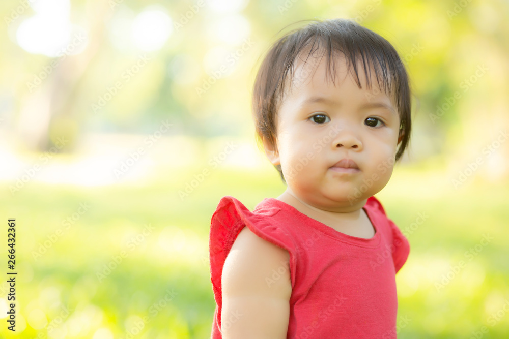 Portrait face of cute asian little girl and child happiness and fun in the park in the summer, smile and happy from asia kid and relax in the garden, lifestyle childhood concept. Portrait face of cute asian little girl and child happiness and fun in the park in the summer, smile and happy from asia kid and relax in the garden, lifestyle childhood concept.