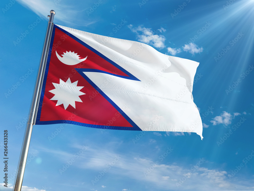 Nepal National Flag Waving on pole against sunny blue sky background. High Definition Nepal National Flag Waving on pole against sunny blue sky background. High Definition