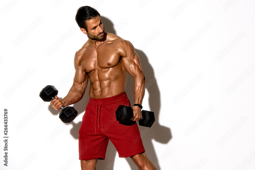 Handsome Male Fitness Model Exercise With Weights