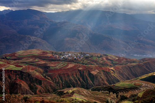 Dongchuan Sunrise, Red Earth Multi-Colored Terraces - Red Soil, Green Grass, Layered Terraces in Yunnan Province, China. Chinese Countryside, Agriculture, Exotic Landscape. Farmland, Agriculture