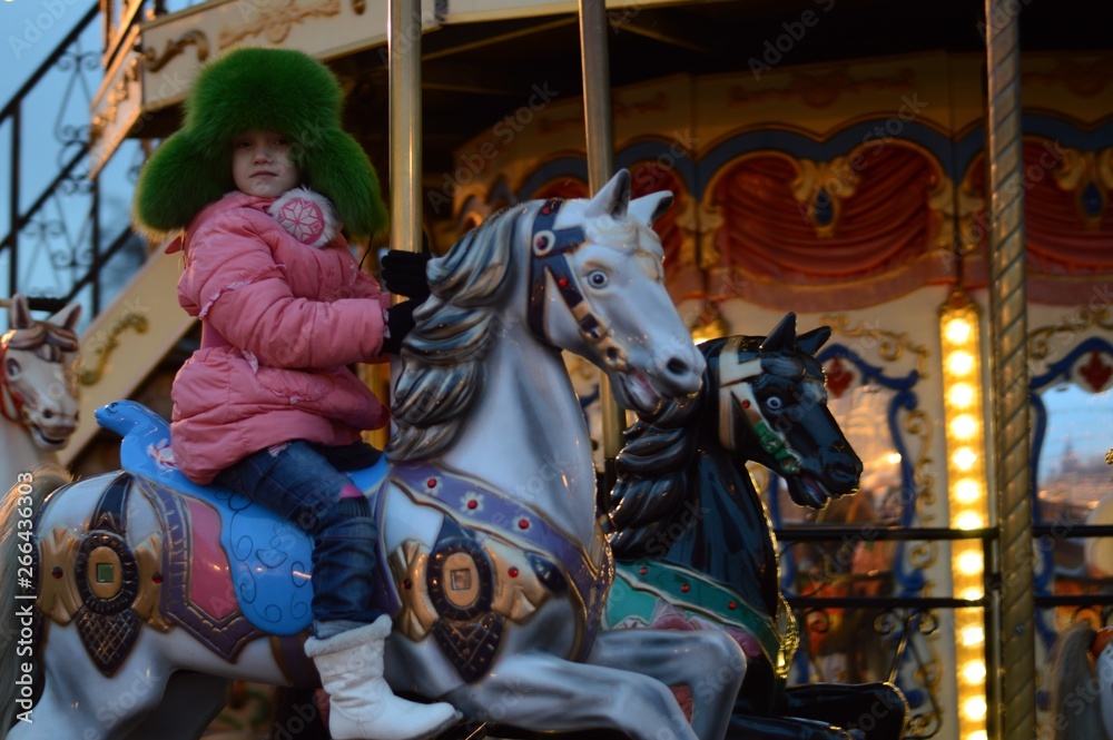 Child on the carousel