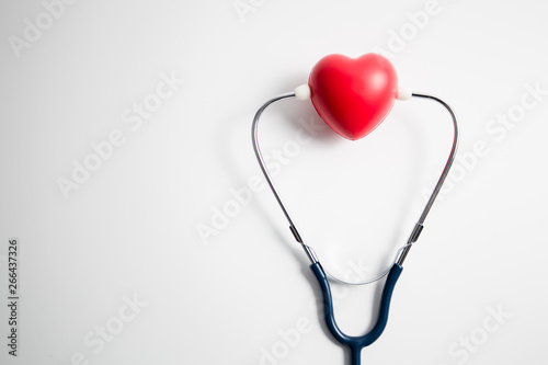 Red heart with stethoscope on white background