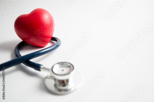 Red heart with stethoscope on white background