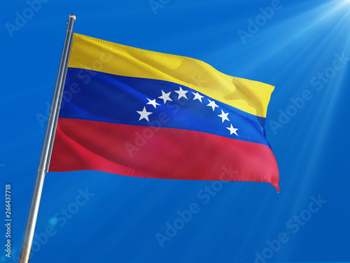 Venezuela National Flag Waving on pole against deep blue sky background. High Definition