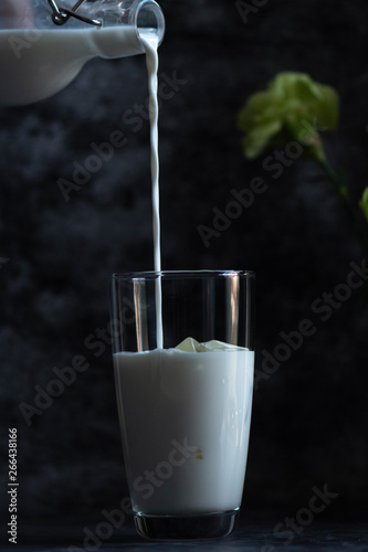 Pour fresh milk into a glas...