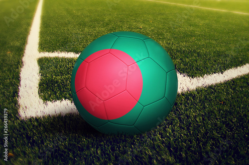 Bangladesh ball on corner kick position  soccer field background. National football theme on green grass.