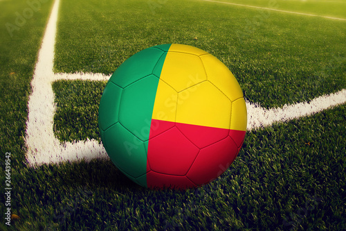Benin ball on corner kick position  soccer field background. National football theme on green grass.