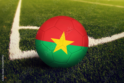 Burkina Faso ball on corner kick position  soccer field background. National football theme on green grass.