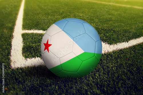 Djibouti ball on corner kick position  soccer field background. National football theme on green grass.