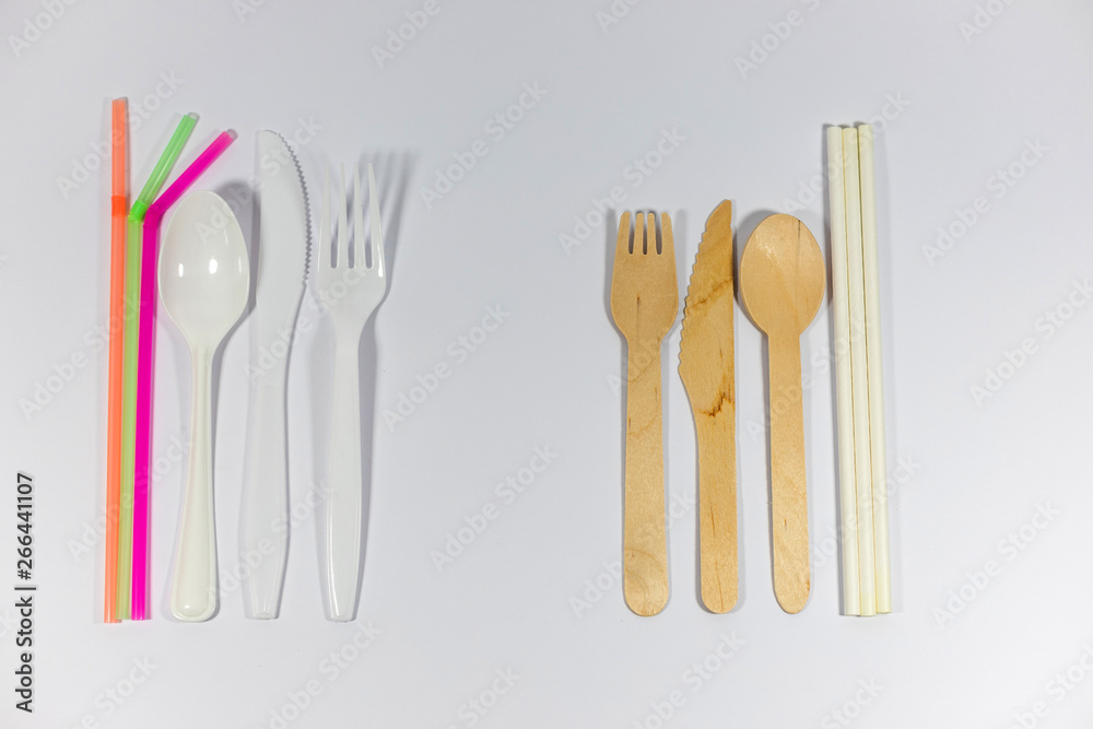 Bamboo cutlery and paper straws isolated on white background