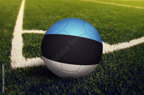 Estonia ball on corner kick position  soccer field background. National football theme on green grass.