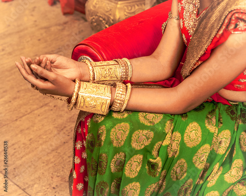 Close up of Decorative hands of Indian Bride with Golden Jewellery. Selective Focus is used.