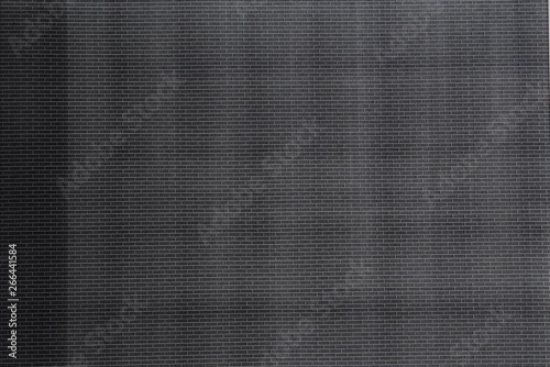 Brick pattern print to test black toner, Black paper texture background.