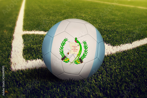 Guatemala ball on corner kick position  soccer field background. National football theme on green grass.